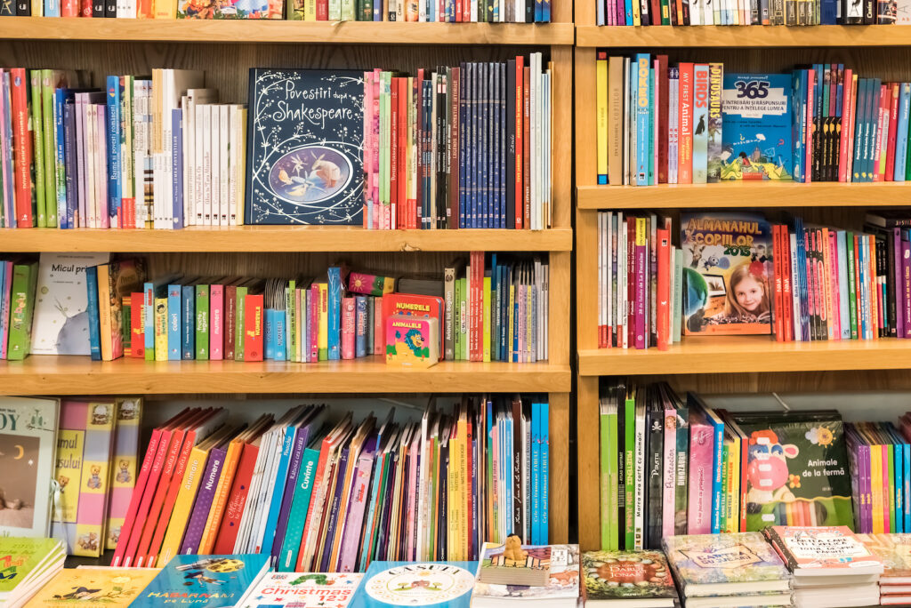 BRASOV, ROMANIA - DECEMBER 22, 2014: Bookshelf In Library With Many Children Books For Sale.